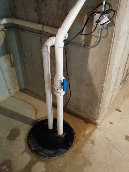 What are the Two Pipes That Empty into My Basement Sump Pump?